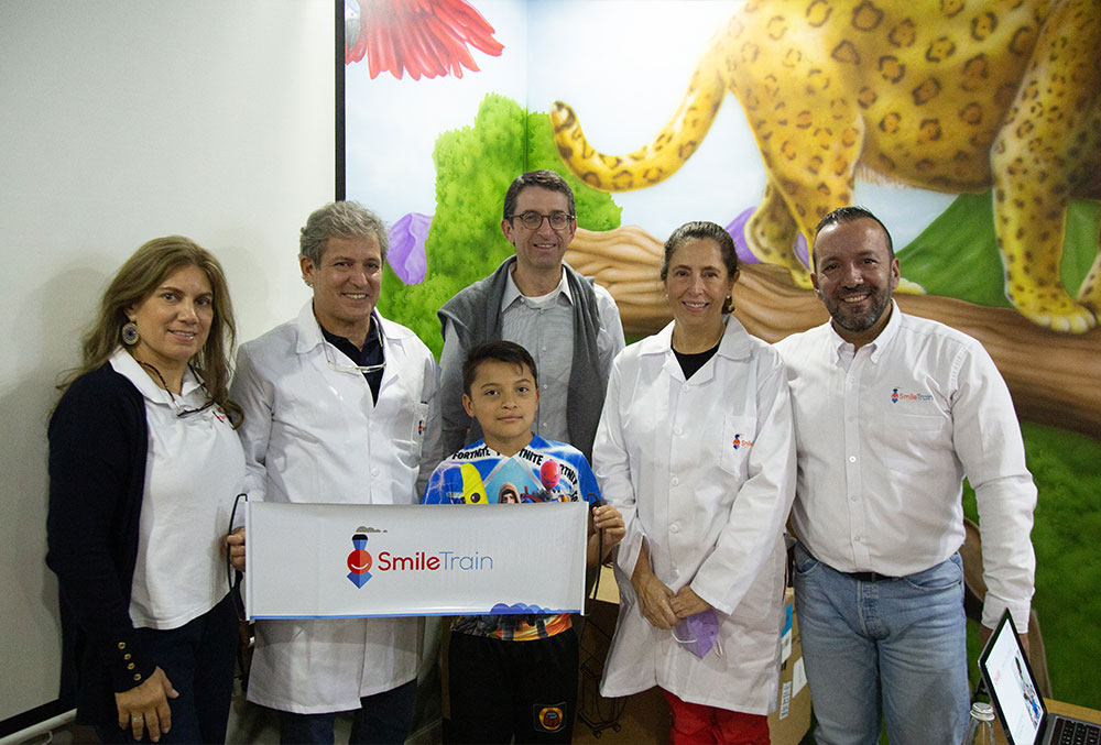 Smile Train and FISULAB staff smiling with a patient