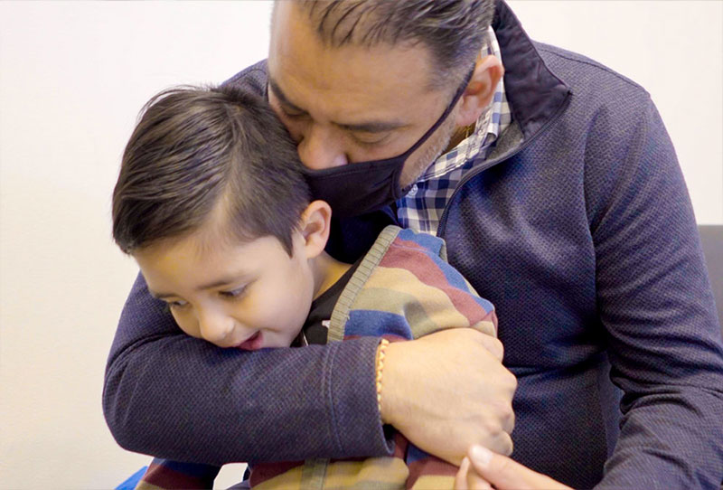 Javier hugging his son Damian