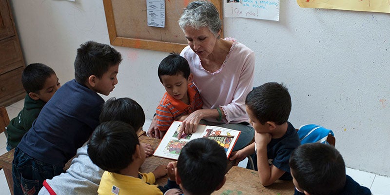 Maria teaching her students