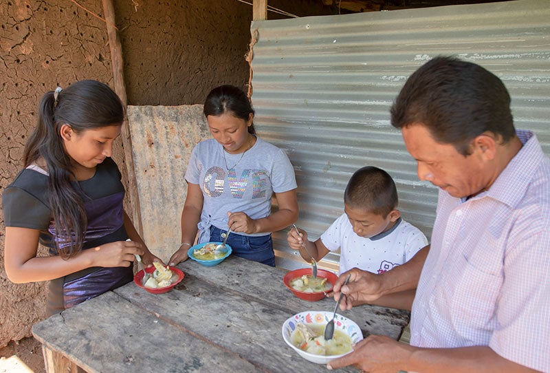 zuleika eating with her family