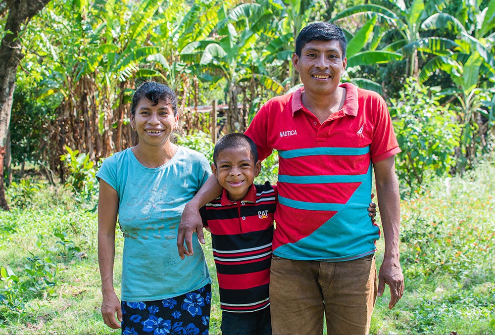 Auner smiling with his parents after cleft surgery