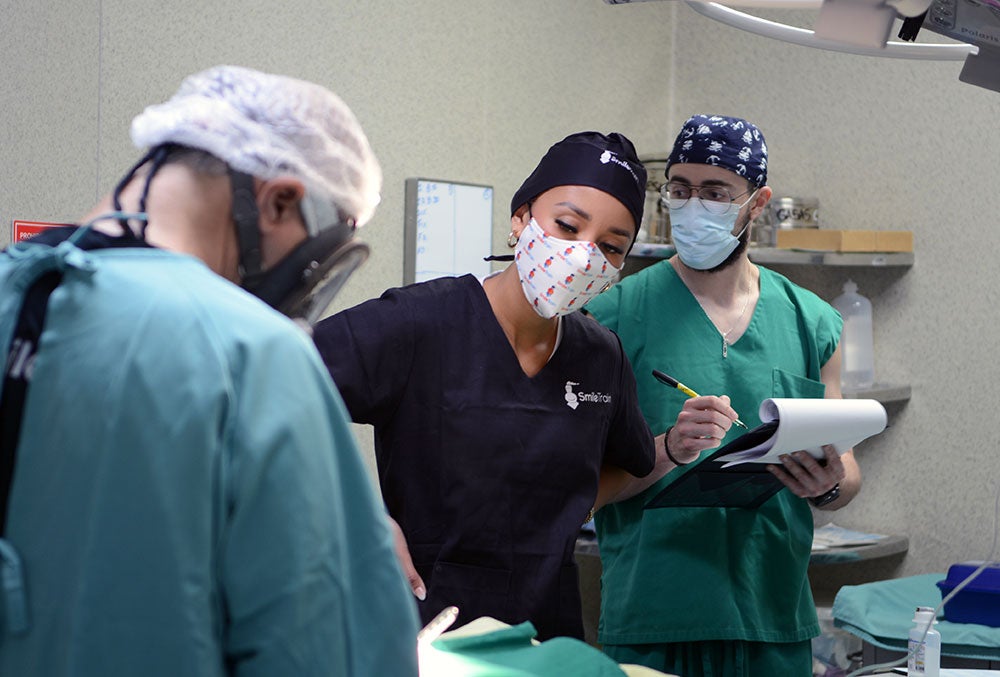 Elle Smith watching a cleft surgery