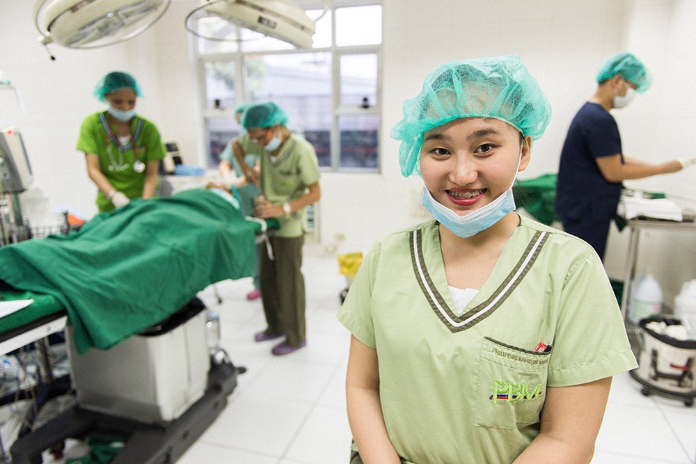 Gracee smiling in the operating room