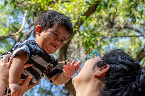 Noelia lifts her son Felix after his cleft surgery