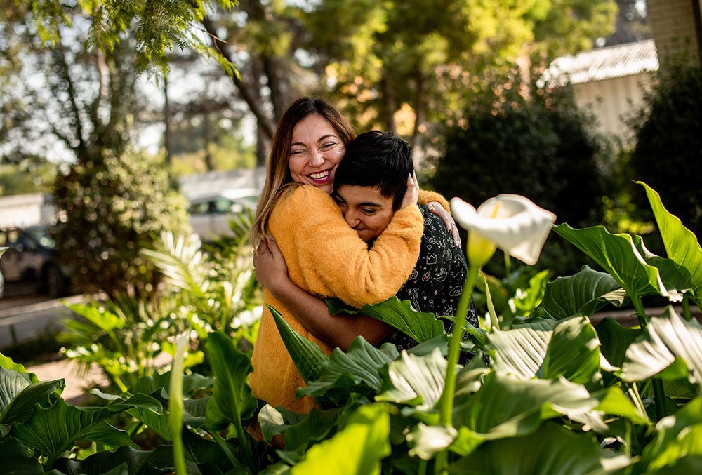 Vicente hugging his mother Paola