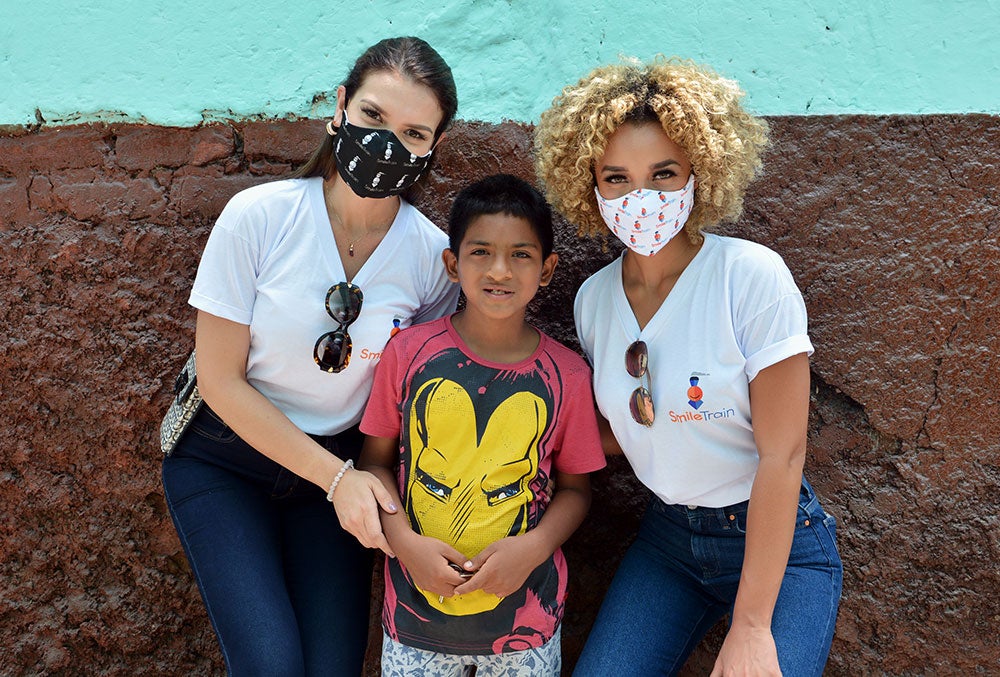 Yely Rivera and Elle Smith smiling with Jory