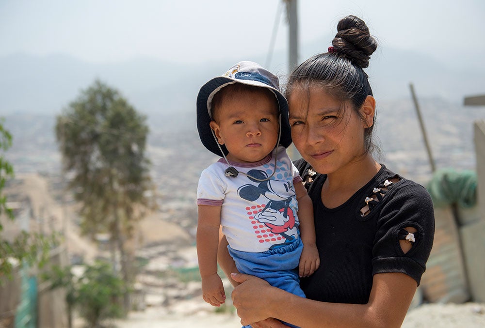 zindia holding joseyur after his cleft surgery