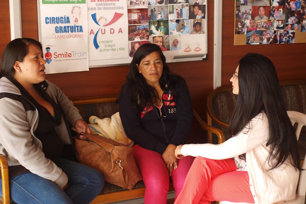 Cristina Solano comforts families of patients