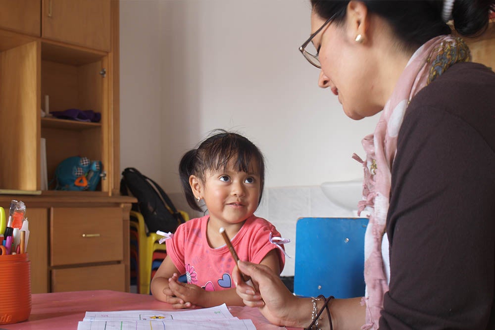 Cristina Solano doing speech treatment with a patient