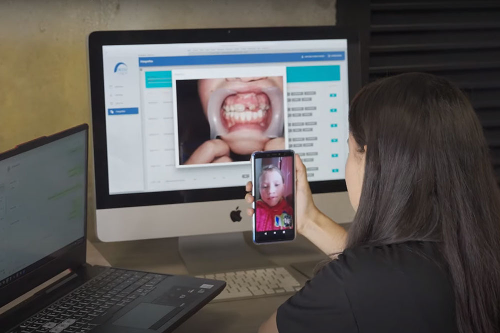Smile Train partners on a video call with a patient