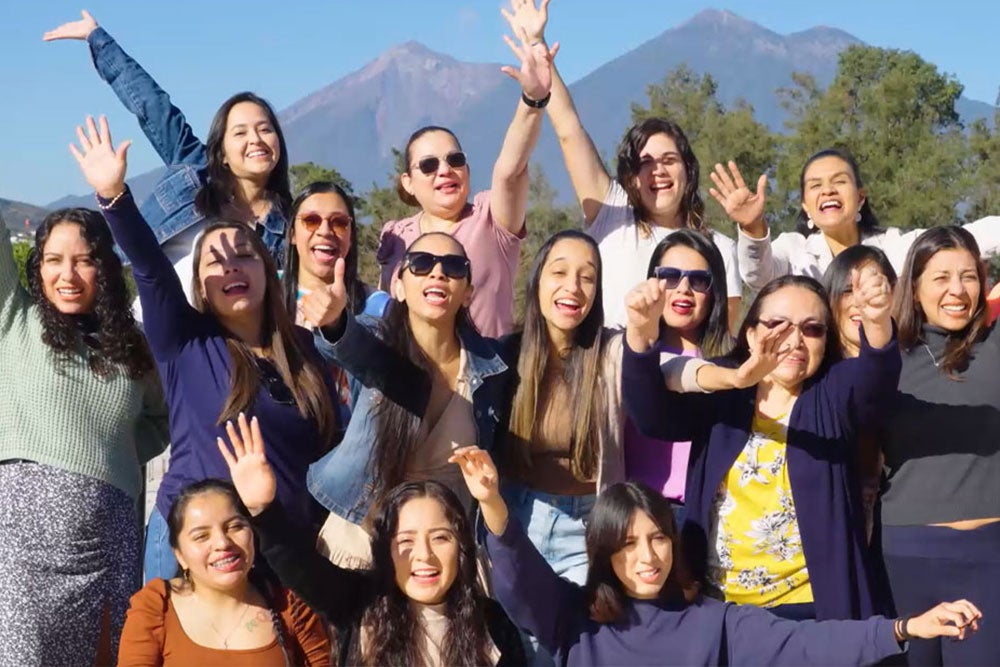 SPOON Training participants smiling and waving