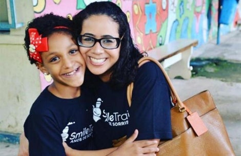 Camila smiling with a patient