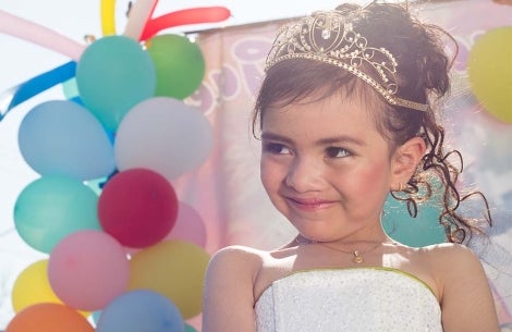 Alexa smiles in front of balloons