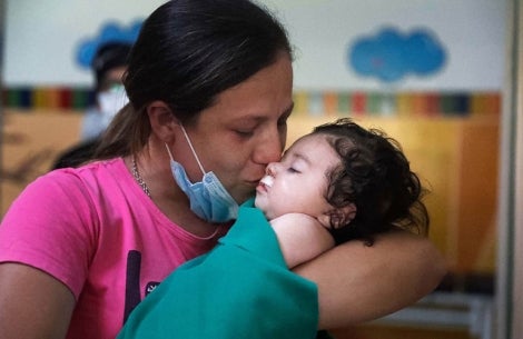 Rocio kissing Maxi after his cleft surgery