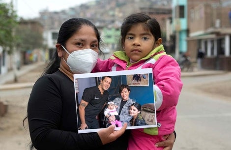 Mia and Luz hold a picture of her before cleft surgery with Kylie and Kris Jenner