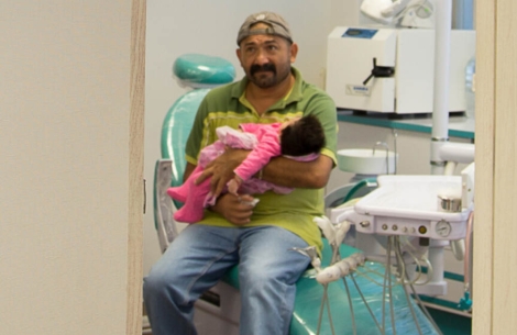 Man holding baby at Centro SUMA