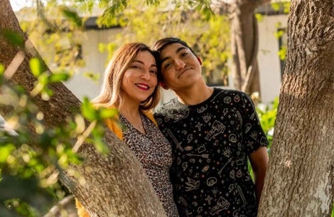 Vicente smiling with his mother, Paola