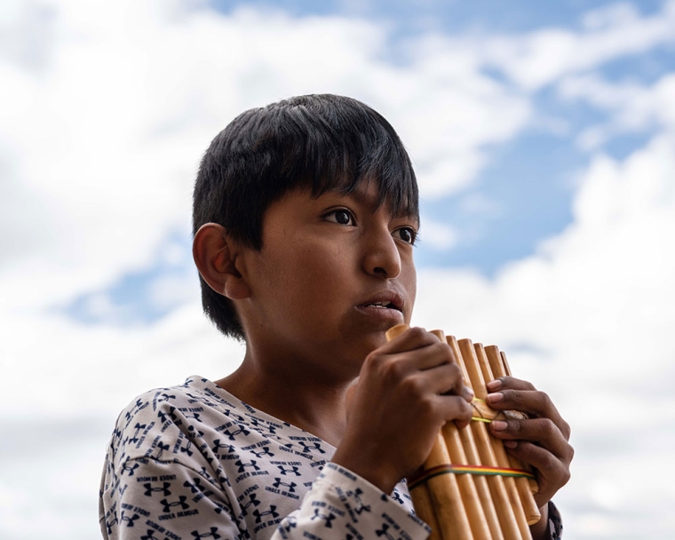 Luis playing the pan flute